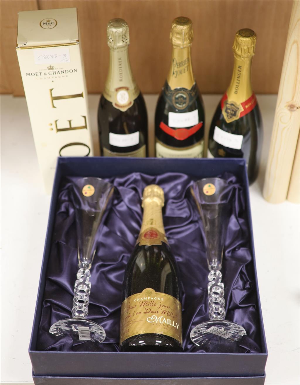 Four bottles of NV Champagne and  Maiily Millennium Champagne with two glasses